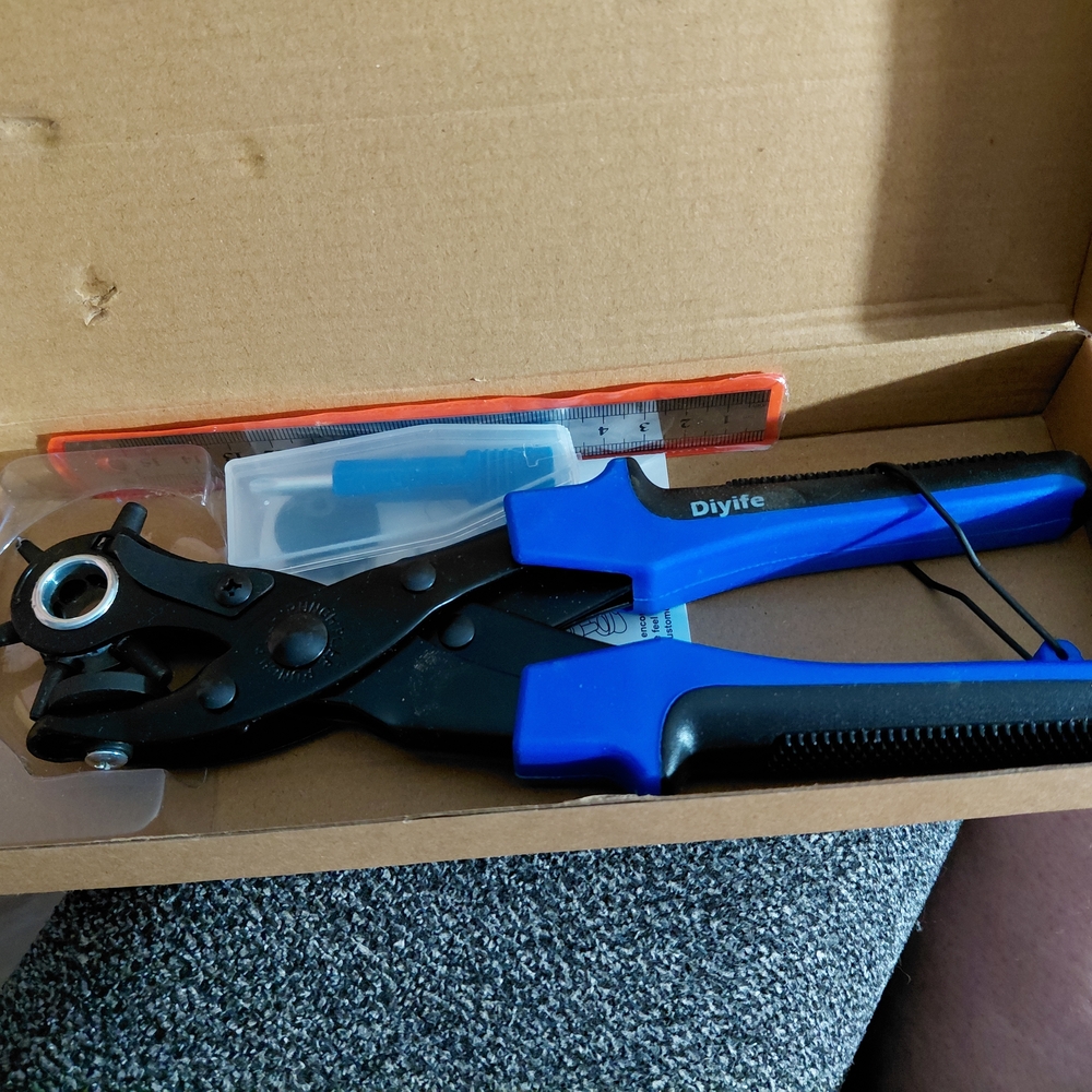 Blue and Black Leather Hole Punch